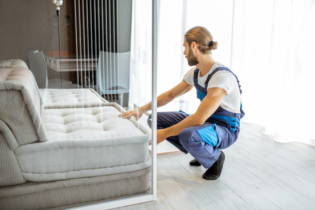 Mover fixing sofa at home